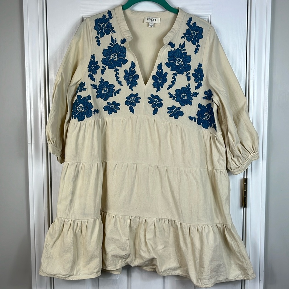 Umgee beige dress with 3/4 sleeves and blue embroidered flowers at top small.